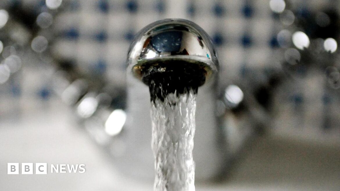 A close-up picture of a running tap. 