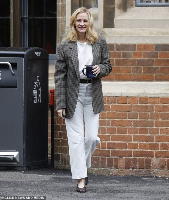 Julia Roberts sported brighter blonde hair as she was seen on the set of her new movie After the Hunt for the first time on Tuesday as filming began in Cambridge