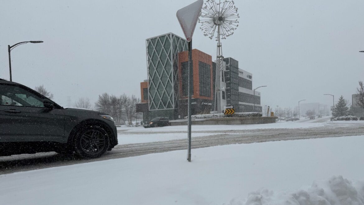 Snow-covered Highway 401 with traffic disruptions near Guelph Line due to accidents.