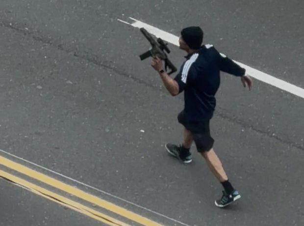 The suspected shooter on Memorial Drive in Cambridge on Monday afternoon. (Reader courtesy photo)